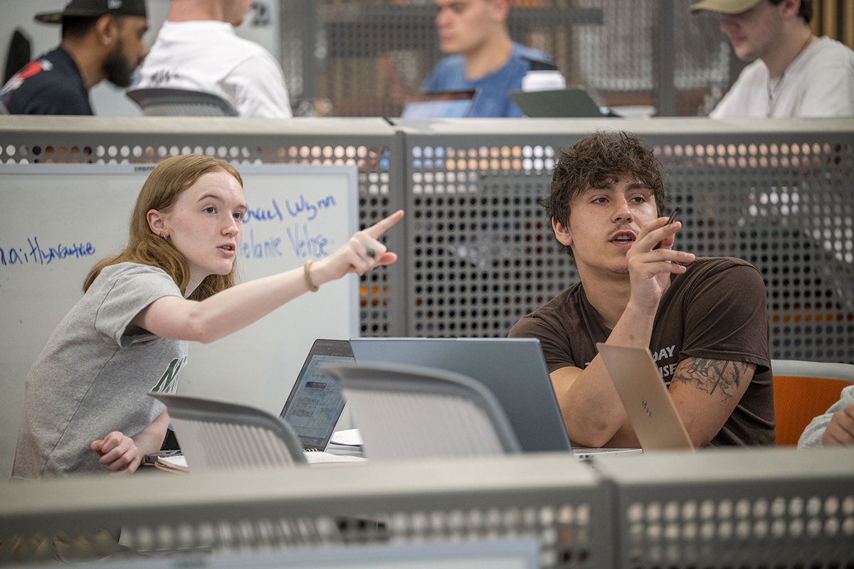 Students pointing during class.