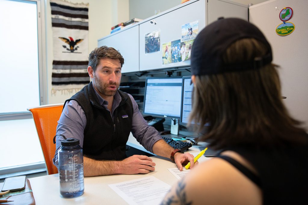 A student meets with an advisor.