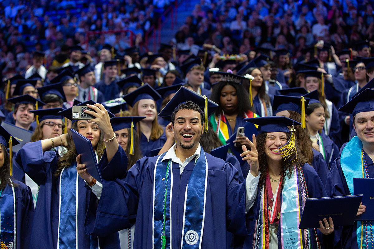 Graduates pose for a group photo.