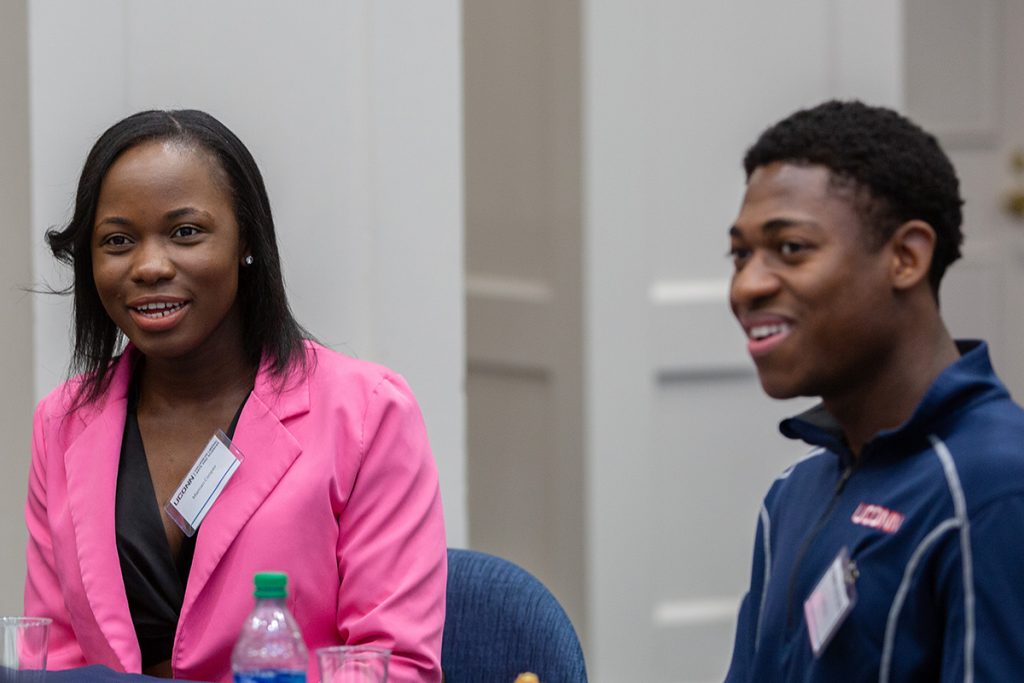 An alum meets with a student in the UConn Alumni Center.