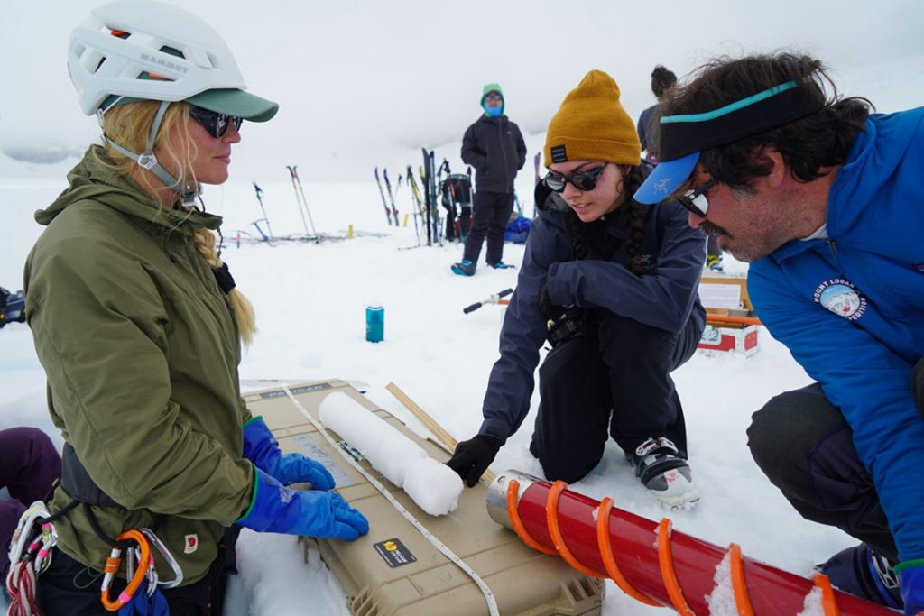 A student participates in snow and ice coring in Alaska.