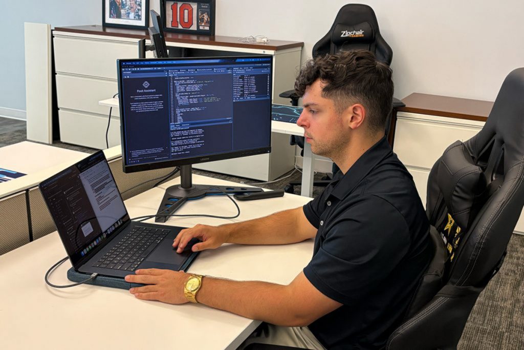 A student sitting at a desk during his internship.